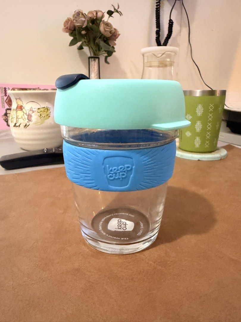 KeepCup Glass Reusable Coffee Cup 12oz / 340ml (Category: Water Bottles & Tumblers) located in Mandaluyong City. Submitted by ohayouclub (Listing ID 1466381817, Image 1). Description: - Authentic KeepCup glass reusable cup - Size: 12oz / 340ml (ideal for daily coffee or tea) - Clear tempered glass body with comfortable feel - Colorway: Mint green lid, dark blue plug, and bright blue silicone grip.
