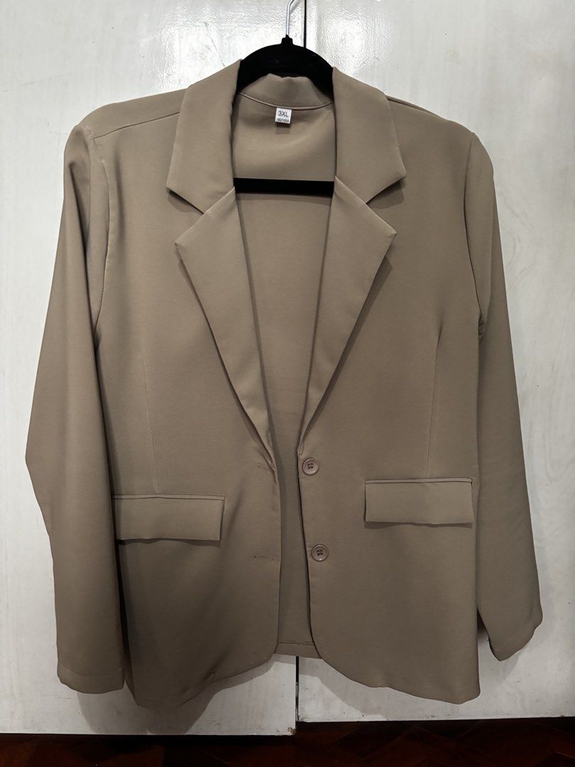 Khaki Blazer Size 3XL (Category: Coats, Jackets and Outerwear) located in Quezon City. Submitted by anacon (Listing ID 1466357567, Image 1). Description: - Style: Single-breasted blazer - Color: Khaki - Details: Structured lapel collar, two front flap pockets, two-button front closure, long sleeves - Size: 3XL - Condition: Excellent - Great for workwear or smart-casual outfits Used only once.