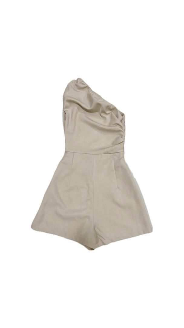 Khaki One-Shoulder Asymmetric Romper (Category: Rompers) located in Paranaque City. Submitted by honeykkkk (Listing ID 1466525190, Image 2). Description: • Details: Chic modern asymmetric one-shoulder neckline with subtle side ruching detail, tailored high waist, and comfortable loose-fit shorts layout. A versatile neutral piece perfect for casual night outs, parties, or weekend dates. • Condition: Excellent condition — worn once only. • Original