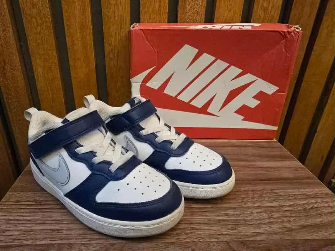 Kids Nike Shoes 10c (Category: Babies & Kids Fashion) located in Marilao. Submitted by majoriety (Listing ID 1466351595, Image 2). Description: - Brand: Nike - Colorway: Blue and white - Style: Classic low-top with lace-up closure and ankle strap - Features: Perforated toe box for breathability - Condition: Clean soles and great structure overall - Inclusions: Comes with original red Nike shoebox - Ideal for: Kids' everyday wear.