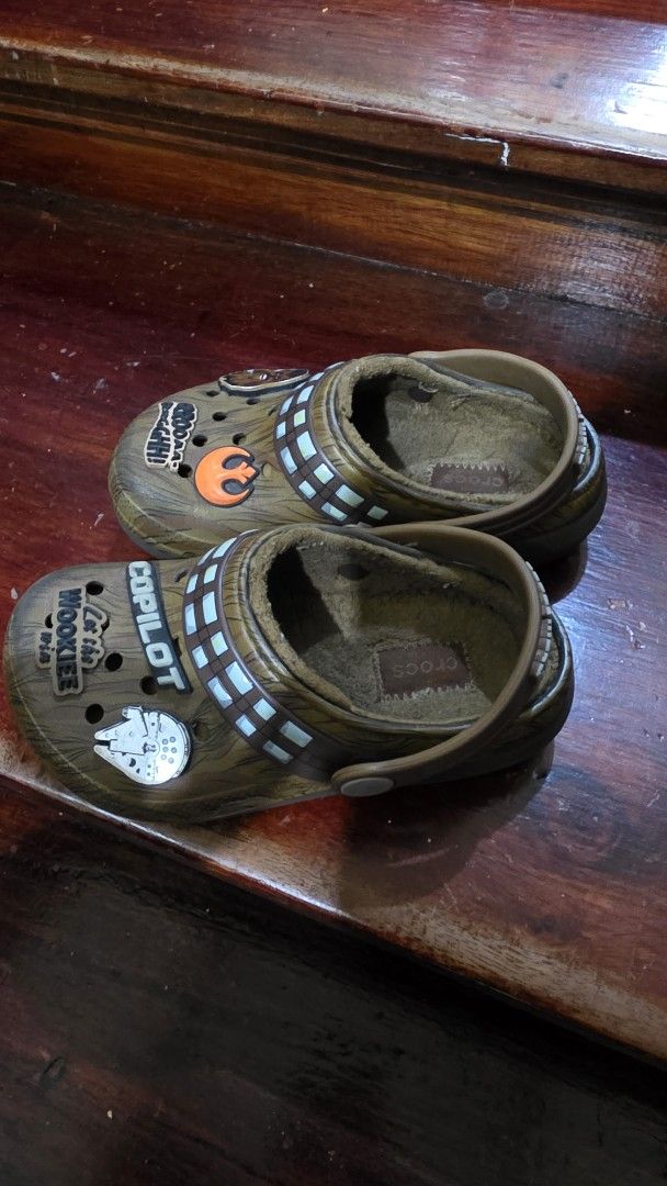 Kids Star Wars Chewbacca Crocs fuzzy lined clogs (Category: Babies & Kids Fashion) located in Valenzuela. Submitted by bella_onez (Listing ID 1466444848, Image 2). Description: - Official Star Wars Chewbacca design with brown furry-look upper - Features built-in bandolier strap details and cool themed Jibbitz charms (Millennium Falcon, Chewbacca face) - Soft fuzzy interior lining to keep your feet warm and cozy - Easy slip-on comfort for everyday