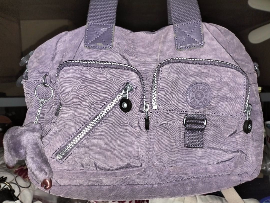 Kipling handbag/body bag (Category: Sling Bags) located in Obando. Submitted by emsky_preloved (Listing ID 1466348195, Image 1). Description: Kipling handbag/body bag. Minimal issue as seen in the picture. Location: Obando Bulacsn.