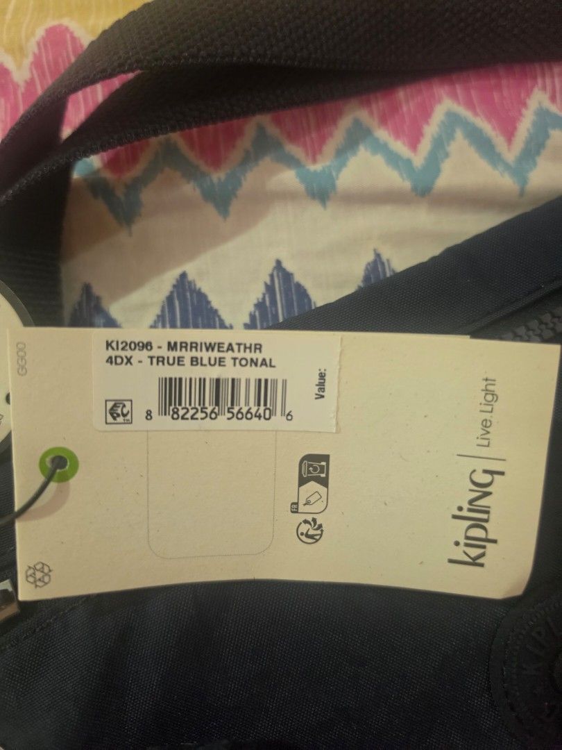 Kipling True Blue Tonal Crossbody Bag (Category: Cross-body Bags) located in Bulacan. Submitted by lemonade.pink (Listing ID 1466498613, Image 3). Description: - Brand new with tags still attached - Model: Kipling Crossbody Bag in True Blue Tonal (KI2096) - Includes the iconic furry monkey keychain - Convenient zippered front pocket for quick access - Adjustable strap with stylish metal hardware - Eco-friendly recycled fabric lining inside - Guar