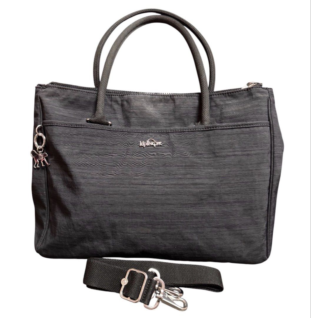 Kipling Two Way Multi Compartment Shoulder Bag (Category: Beach Bags) located in Baguio. Submitted by pwz-eshop (Listing ID 1466392684, Image 1). Description: • Up for Grabs!! • Guaranteed Authentic!! • Flaws: Stains on lining. (please see photos) • BRAND: KIPLING. • DIMENSIONS: length 16", height 11", width 6.5", handle drop: 7.5". • SERIAL NUMBER: With code. • COUNTRY OF ORIGIN: CHINA. • MATERIAL: Polyester. • COLOR: Black. • Lining: Canvas. • 