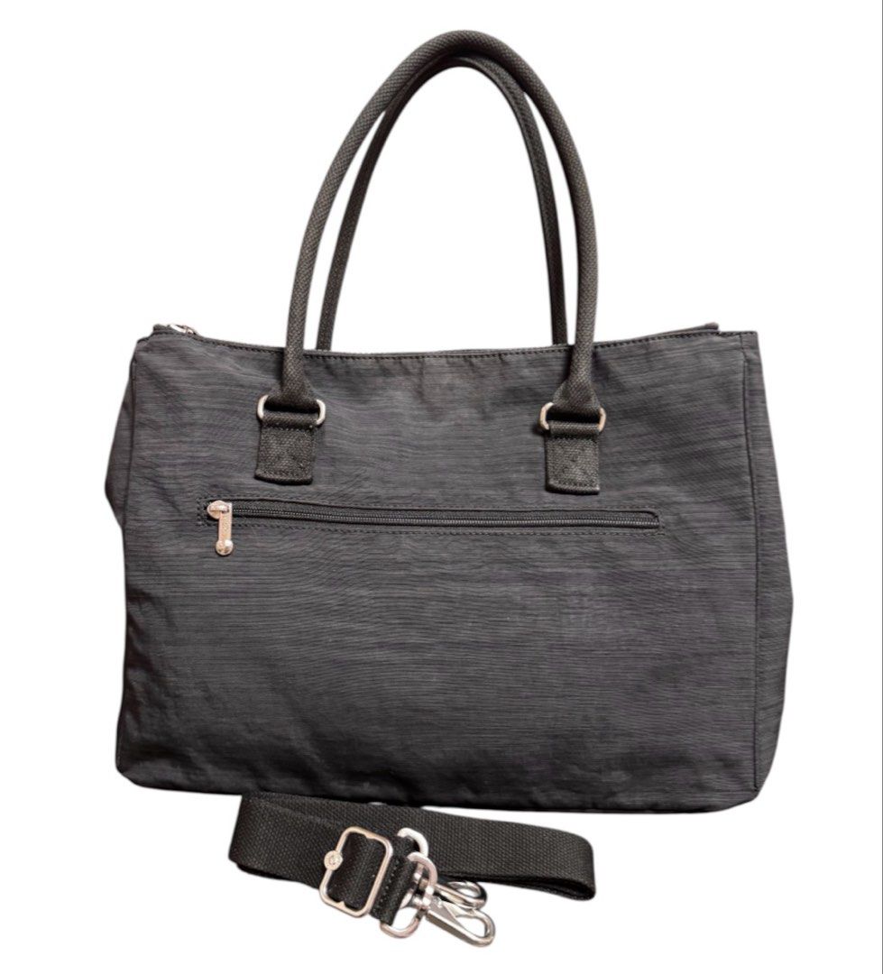 Kipling Two Way Multi Compartment Shoulder Bag (Category: Beach Bags) located in Baguio. Submitted by pwz-eshop (Listing ID 1466392684, Image 2). Description: • Up for Grabs!! • Guaranteed Authentic!! • Flaws: Stains on lining. (please see photos) • BRAND: KIPLING. • DIMENSIONS: length 16", height 11", width 6.5", handle drop: 7.5". • SERIAL NUMBER: With code. • COUNTRY OF ORIGIN: CHINA. • MATERIAL: Polyester. • COLOR: Black. • Lining: Canvas. • 