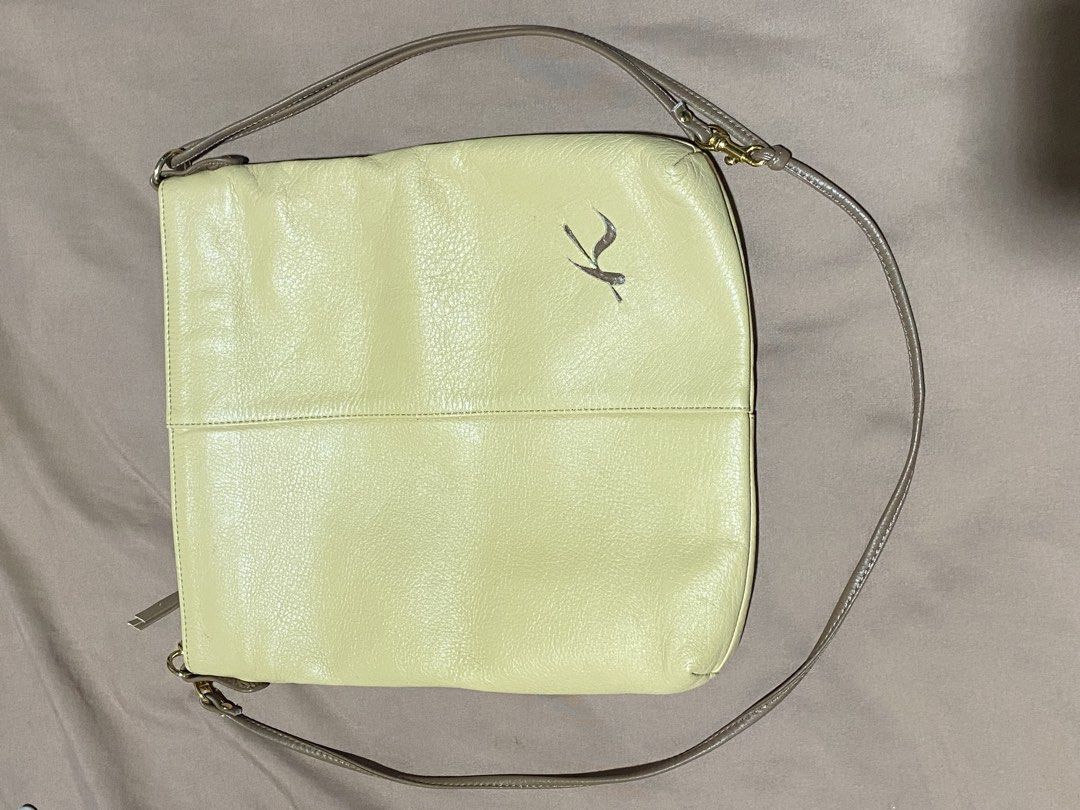 Kitamura Light Yellow Leather Crossbody Bag (Category: Cross-body Bags) located in Manila. Submitted by cdb_22 (Listing ID 1466438640, Image 2). Description: - Brand: Kitamura - Style: Crossbody bag - Color: Light yellow with brown straps and trim - Material: Genuine leather with smooth monogram-patterned lining - Hardware: Smooth YKK zippers - Branding: Debossed 'K' logo on the front lower corner - Compartments: Main zip compartment, interior zi