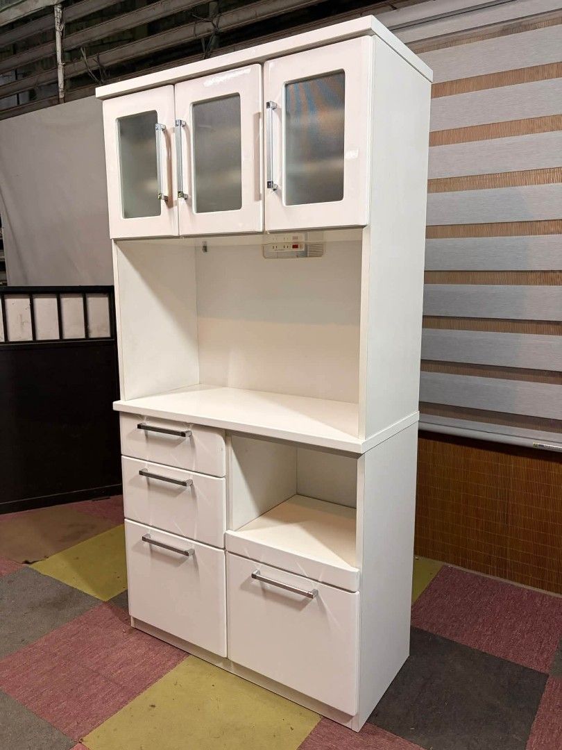 Kitchen Cabinet (Category: Shelves, Cabinets & Racks) located in Meycauayan. Submitted by marygracecasimiro (Listing ID 1466390561, Image 3). Description: NITORI Dahlia 100KB Kitchen Organizer Cabinet DUCO FINISH!!! Glass Upper Cabinets Adjustable Shelves, Power Extension Outlets 220V Pullout Shelf for Rice Cooker Medium to Large Storage Drawers Price : 10,500 ✅ 36L x 17W x 71H inches In VERY good condition 💚 Sale:8500🩷.