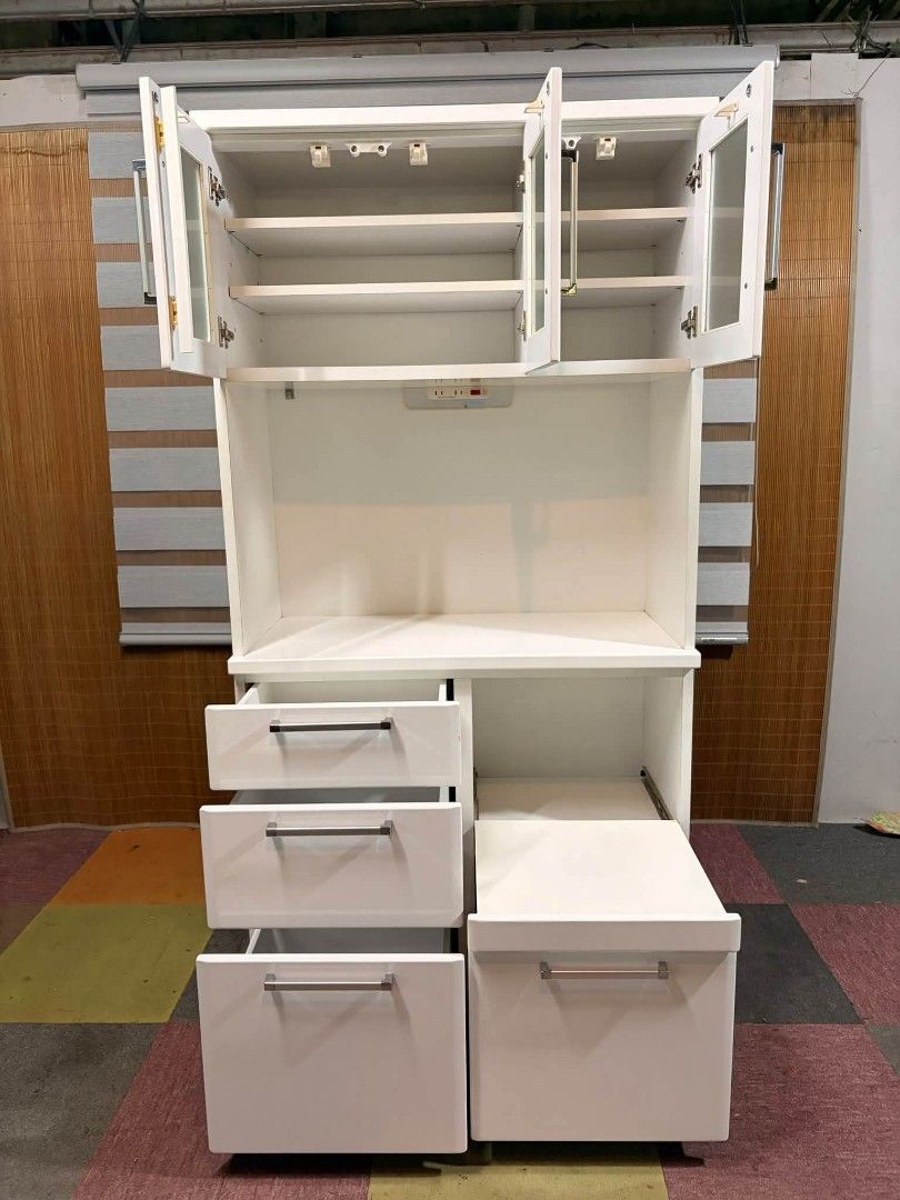 Kitchen Cabinet (Category: Shelves, Cabinets & Racks) located in Meycauayan. Submitted by marygracecasimiro (Listing ID 1466390561, Image 2). Description: NITORI Dahlia 100KB Kitchen Organizer Cabinet DUCO FINISH!!! Glass Upper Cabinets Adjustable Shelves, Power Extension Outlets 220V Pullout Shelf for Rice Cooker Medium to Large Storage Drawers Price : 10,500 ✅ 36L x 17W x 71H inches In VERY good condition 💚 Sale:8500🩷.