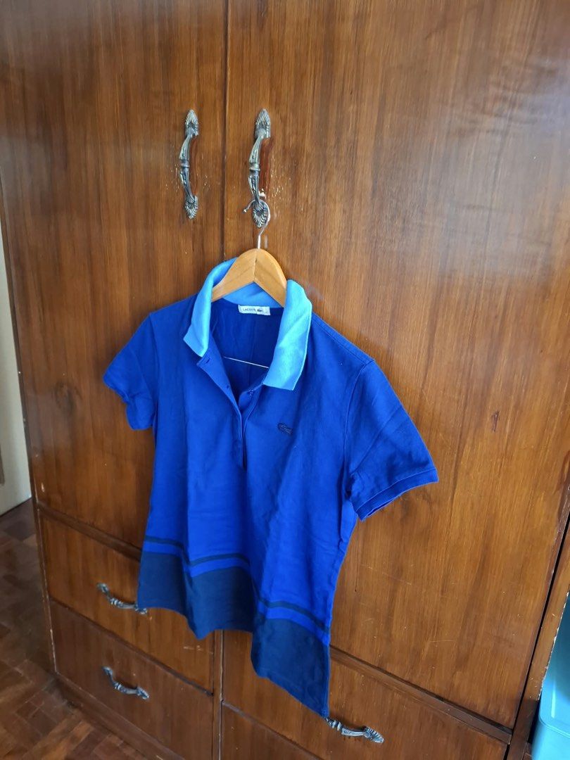 Lacoste Blue Polo Shirt Size 44 (Category: Tshirts & Polo Shirts ) located in Manila. Submitted by bunbun__ (Listing ID 1466415168, Image 2). Description: - Brand: Lacoste - Color: Blue with light blue collar and darker blue hem panel - Size: 44 (Standard fit) - Style: Short sleeves, button placket, classic cut - Mode of Payment: BPI, BDO, or GCash - Shipping: Via J&T Express or Lalamove (Buyer shoulders fee).