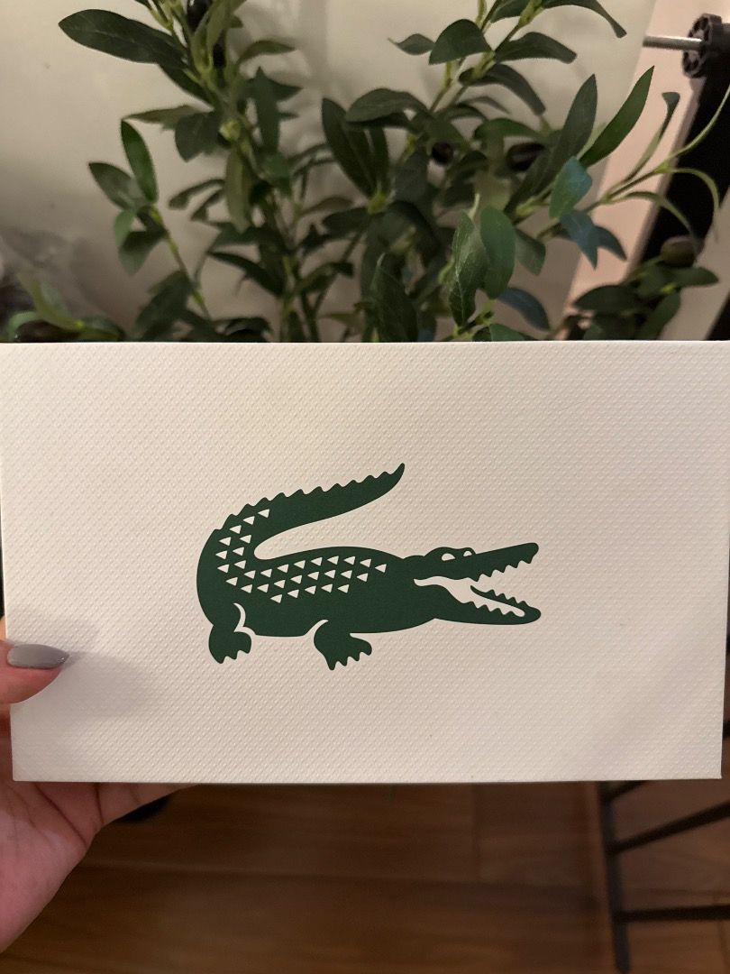 Lacoste Croc Logo White Textured Card (Category: Wallets & Card holders) located in Taytay. Submitted by jammam1226 (Listing ID 1466453542, Image 1). Description: - Item: Authentic Lacoste card stock - Design: White textured with central green crocodile logo - Condition: Used once/ almost new - Size: Standard rectangular - Perfect for: Gifting, packaging, or brand collecting.