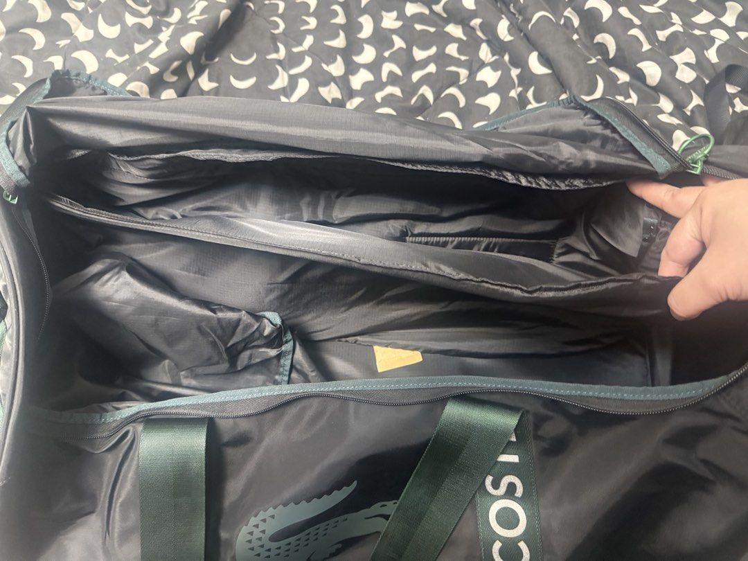Lacoste L23 Tennis Duffle Bag (Category: Racket and Ball Sports) located in Taytay. Submitted by julesantenor (Listing ID 1466477747, Image 2). Description: Purchased this for 18.9k from Sportlines PH. Condition is still like new as it is barely used. It has its own removable tennis racket compartment. Reason for selling is that I prefer a backpack over a duffle for tennis The Lacoste L23 Tennis Bag is a durable and practical choice for tennis pl