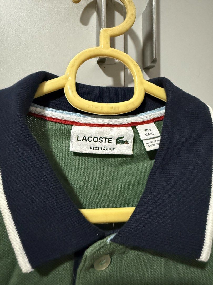 Lacoste Regular Fit Polo Shirt Green (Category: Tshirts & Polo Shirts ) located in Manila. Submitted by mpt99876 (Listing ID 1466520982, Image 3). Description: - Authentic Green Lacoste Polo Shirt - Size: XL - Fit: Regular - Features: Classic crocodile logo on chest - Design: Contrasting navy collar and pocket trim with white stripes - Sleeves: Short with navy trim - Closure: Button-up placket.