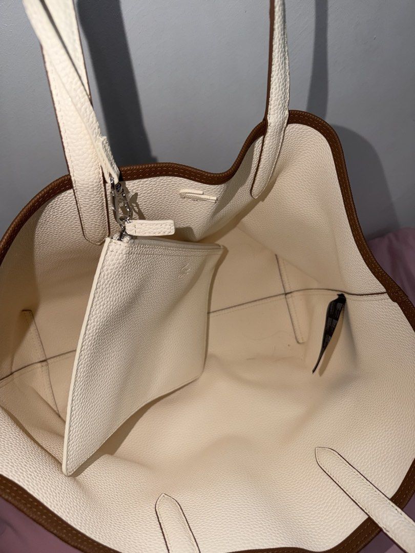 Lacoste Reversible Tote Bag Brown White (Category: Tote Bags) located in Batangas. Submitted by ckpanpan184 (Listing ID 1466442928, Image 3). Description: Condition: 9/10 – Excellent condition Authenticity: Original from Japan Inclusions: Comes with original dustbag RFS: Decluttering Bought Price: ₱12k Well-maintained and only lightly used. ✨ - Authentic Lacoste reversible tote bag (Brown / Textured White) - Versatile 2-in-1 design with a small e