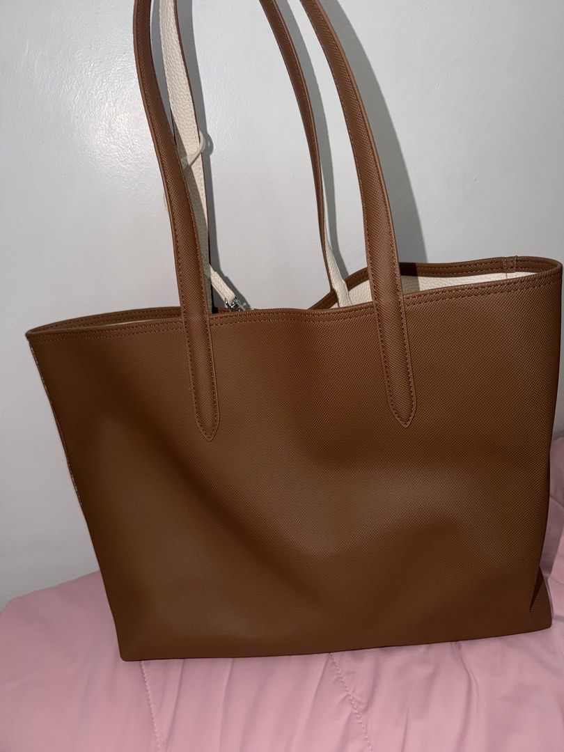 Lacoste Reversible Tote Bag Brown White (Category: Tote Bags) located in Batangas. Submitted by ckpanpan184 (Listing ID 1466442928, Image 2). Description: Condition: 9/10 – Excellent condition Authenticity: Original from Japan Inclusions: Comes with original dustbag RFS: Decluttering Bought Price: ₱12k Well-maintained and only lightly used. ✨ - Authentic Lacoste reversible tote bag (Brown / Textured White) - Versatile 2-in-1 design with a small e