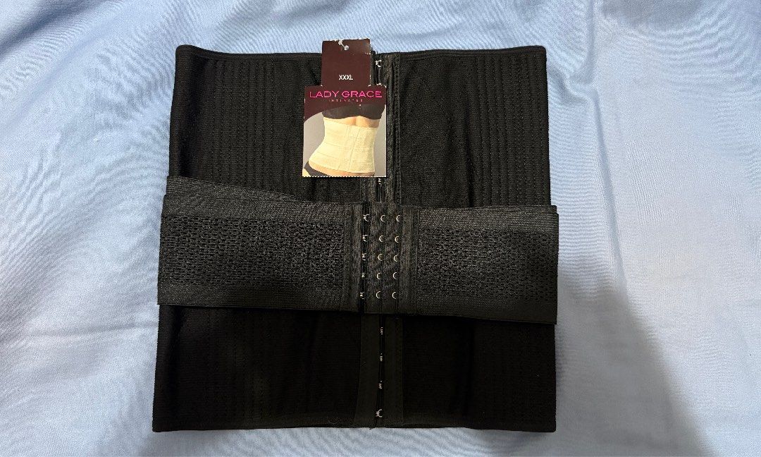 Lady Grace Intimates Black Waist Trainer (Category: Undergarments & Loungewear) located in Manila. Submitted by maria_mk (Listing ID 1466467228, Image 1). Description: Lady Grace Intimates waist trainer in solid black. Size XXXL. Hook and eye front closure with adjustable mesh side straps for extra support and compression. Original store tag still attached, showing price of 1,299.75. Never worn..