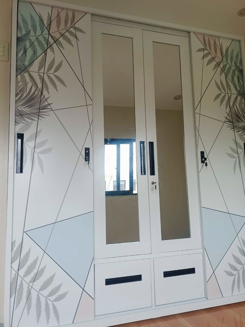 Large wardrobe with mirrored doors and tropical leaf pattern (Category: Shelves, Cabinets & Racks) located in Caloocan City. Submitted by swiftdolphin.2aa81b (Listing ID 1466356548, Image 1). Description: Upgrade your bedroom with this spacious steel wardrobe ✨ Modern marble design with mirrored doors, perfect for keeping your room neat and organized. ✅ Large storage capacity ✅ Hanging area for clothes ✅ Multiple shelves for folded items ✅ 2 spac