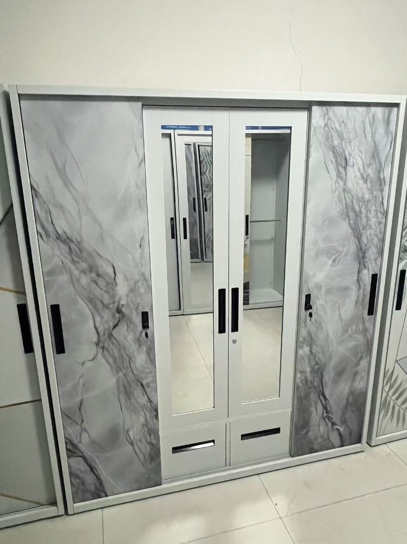 Large wardrobe with mirrored doors and tropical leaf pattern (Category: Shelves, Cabinets & Racks) located in Caloocan City. Submitted by swiftdolphin.2aa81b (Listing ID 1466356548, Image 3). Description: Upgrade your bedroom with this spacious steel wardrobe ✨ Modern marble design with mirrored doors, perfect for keeping your room neat and organized. ✅ Large storage capacity ✅ Hanging area for clothes ✅ Multiple shelves for folded items ✅ 2 spac