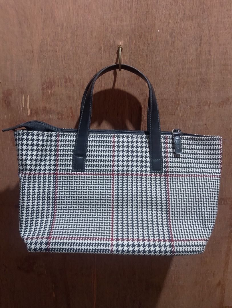 Lauren Ralph Lauren Houndstooth Pattern Tote Bag (Category: Tote Bags) located in Cavite. Submitted by marvzclothing (Listing ID 1466428407, Image 2). Description: - Brand: Lauren Ralph Lauren - Pattern: Classic black and white houndstooth with stylish red accent lines - Material/Trim: Premium dark leather dual top handles and matching trim - Hardware: Gold-tone metal front logo plate and branded zipper pull - Closure: Secure top zipper closure -