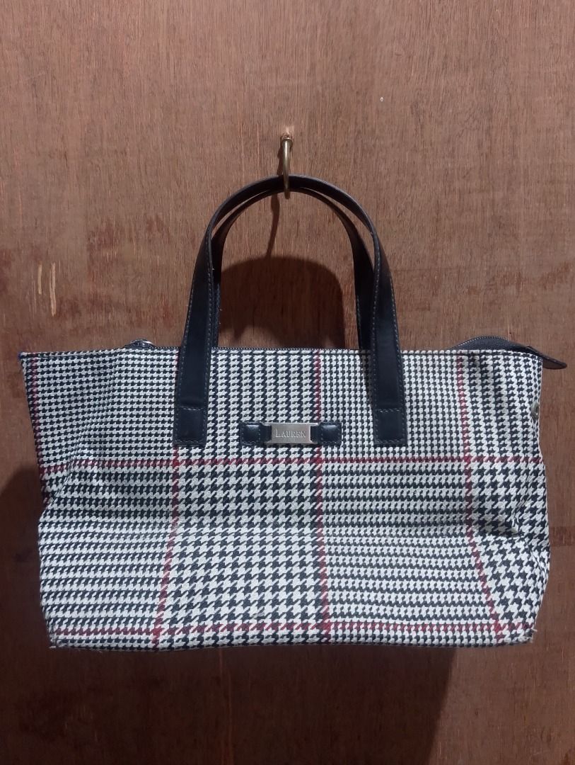 Lauren Ralph Lauren Houndstooth Pattern Tote Bag (Category: Tote Bags) located in Cavite. Submitted by marvzclothing (Listing ID 1466428407, Image 1). Description: - Brand: Lauren Ralph Lauren - Pattern: Classic black and white houndstooth with stylish red accent lines - Material/Trim: Premium dark leather dual top handles and matching trim - Hardware: Gold-tone metal front logo plate and branded zipper pull - Closure: Secure top zipper closure -