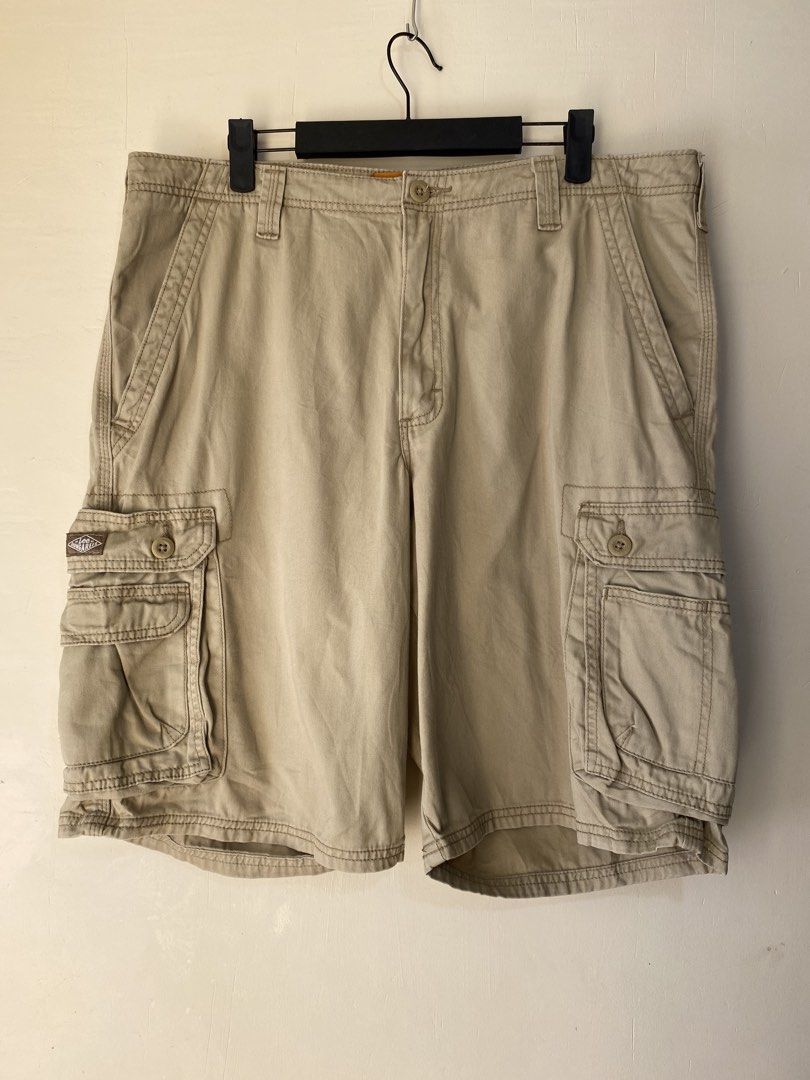 LEE, Cargo shorts (Category: Shorts) located in Cavite. Submitted by jc_thrift95 (Listing ID 1466492251, Image 1). Description: - a pair of Lee Men’s Dungarees Wyoming Cargo Shorts in a khaki/tan colorway. • Brand: Lee (Dungarees line) • Style: Multi-pocket cargo shorts with side flap pockets, button closure, and a woven Lee label on the cargo pocket. • Material: Heavyweight cotton twill / canvas. - Made in Bangladesh - L- 22 inch - W- 19 inch - 