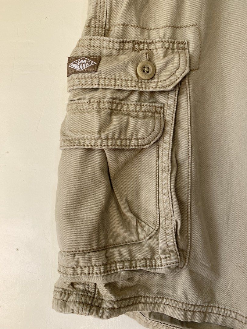 LEE, Cargo shorts (Category: Shorts) located in Cavite. Submitted by jc_thrift95 (Listing ID 1466492251, Image 3). Description: - a pair of Lee Men’s Dungarees Wyoming Cargo Shorts in a khaki/tan colorway. • Brand: Lee (Dungarees line) • Style: Multi-pocket cargo shorts with side flap pockets, button closure, and a woven Lee label on the cargo pocket. • Material: Heavyweight cotton twill / canvas. - Made in Bangladesh - L- 22 inch - W- 19 inch - 