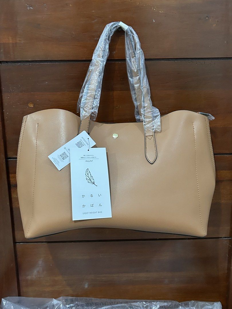Legato Largo Light Weight Tote Bag Brown (Category: Tote Bags) located in Pasig City. Submitted by krishnasingh2020 (Listing ID 1466401804, Image 1). Description: - Brand: Legato Largo - Color: Nice brown shade - Condition: Brand new with tags attached, handles still in original plastic - Features: Super lightweight, spacious interior, secure zipped middle compartment, and magnetic closure - Ideal for: Daily use, work, or school.