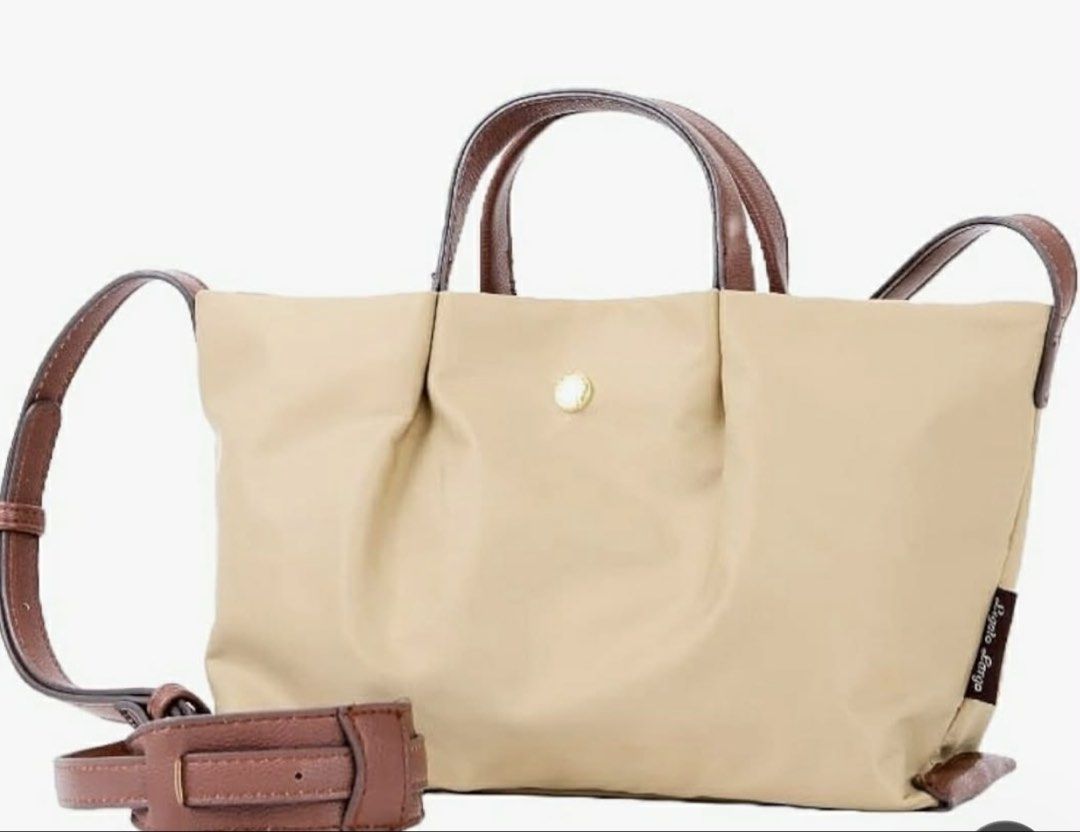 Legato Largo Sling Bag (Category: Shoulder Bags) located in Las Pinas. Submitted by ladyattire (Listing ID 1466373481, Image 2). Description: - Brand: Legato Largo (Shoulder-Friendly Series) - Condition: Brand new with original tags in plastic packaging - Colors Available: Beige (BE) and Navy (NV) - Features: Lightweight design and water-repellent fabric - Details: Brown faux leather handles, adjustable shoulder strap, and gold-tone hardware with
