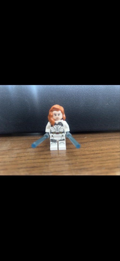 LEGO Marvel Black Widow White Suit Minifigure with Batons (Category: Lego & Building Sets) located in Makati City. Submitted by rcg98 (Listing ID 1466472313, Image 1). Description: - Character: Black Widow in White Suit (Marvel) - Condition: Excellent, clean printing on face and outfit - Includes: Red hair piece and 2 translucent blue baton weapons - Details: White torso and legs with printed armor and black belt - Ideal for: Marvel superhero and