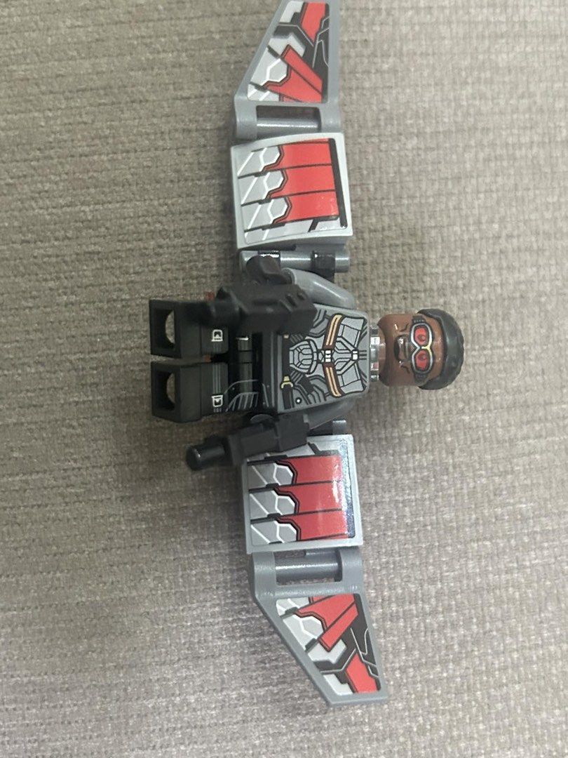 LEGO Marvel Falcon Minifigure with Wings (Category: Lego & Building Sets) located in Makati City. Submitted by rcg98 (Listing ID 1466474703, Image 1). Description: - Character: LEGO Falcon from Marvel Avengers - Outfit: Grey tactical suit printing on torso and legs - Accessories: Buildable articulated grey and red wings, plus black weapons - Details: Head features red goggles and short black hair - Condition: Great collector's piece for completin