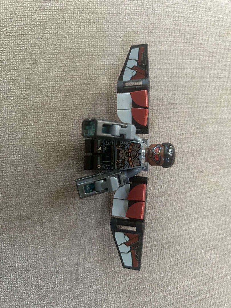 LEGO Marvel Falcon Minifigure with Wings and Blasters (Category: Lego & Building Sets) located in Makati City. Submitted by rcg98 (Listing ID 1466474790, Image 1). Description: - Genuine LEGO Falcon minifigure from the Marvel Avengers series - Features detailed tactical suit torso, black legs, and moulded hair with red goggles - Includes large posable buildable wings with red and grey panels - Comes with two grey hand-held stud shooter blasters -