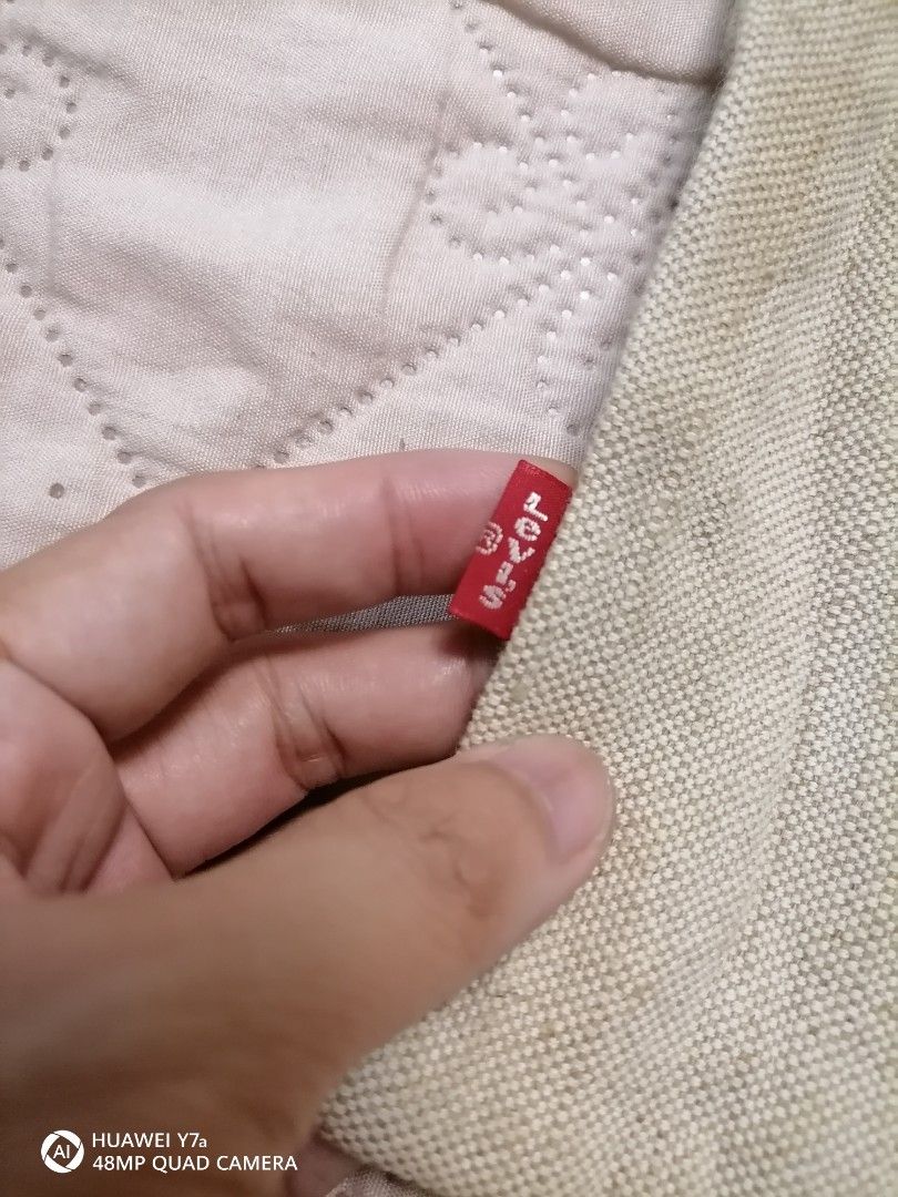 Levi's 501 Canvas Tote Bag (Category: Tote Bags) located in Naga. Submitted by mrwisethrifter (Listing ID 1466365635, Image 3). Description: - Authentic Levi's off-white canvas tote bag - Features iconic 501 button fly graphic and signature red tab - Durable heavy cotton material with contrast red stitching - Single shoulder strap design for easy carrying - Spacious and versatile for books, groceries, or daily essentials - Condition: Brand new / 