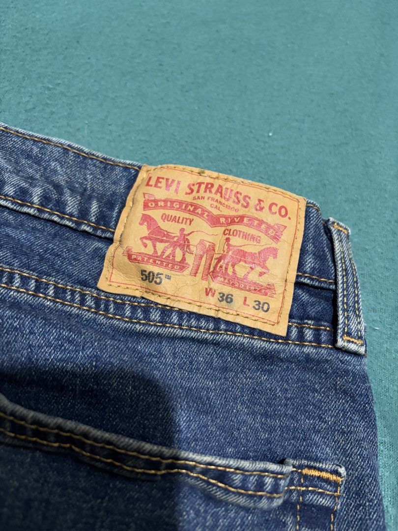 Levi's 505 Regular Fit Jeans W36 L30 (Category: Jeans) located in Guihulngan. Submitted by fbthriftgoodsniace (Listing ID 1466362451, Image 3). Description: - Brand/Model: Classic Levi's 505 Denim Jeans - Wash: Versatile Medium Blue - Details: Traditional five-pocket setup, sturdy belt loops, and iconic contrast yellow stitching - Branding: Authentic leather patch on the back waistband - Condition: Great everyday staple denim ready to wear.