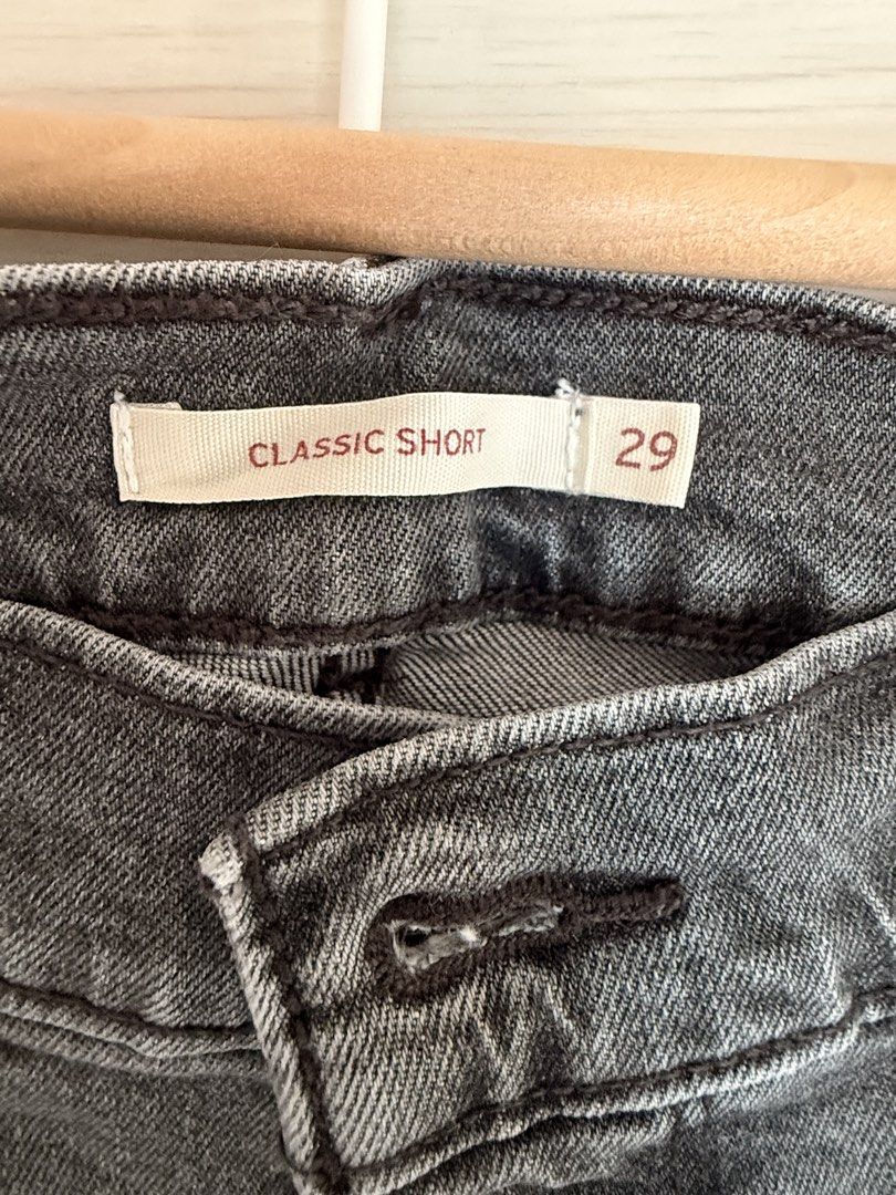 Levi's Classic Short Black Denim Size 29 (Category: Shorts) located in Taguig. Submitted by _annaq_ (Listing ID 1466384822, Image 2). Description: - Brand: Levi's - Color: Washed black - Size: 29 (inner tag) - Style: Classic five-pocket with button fly - Details: Raw hem with frayed edges, back leather patch, and signature red tab - Condition: Great everyday staple piece - Ships immediately across the Philippines! For everyone’s fairness and tran