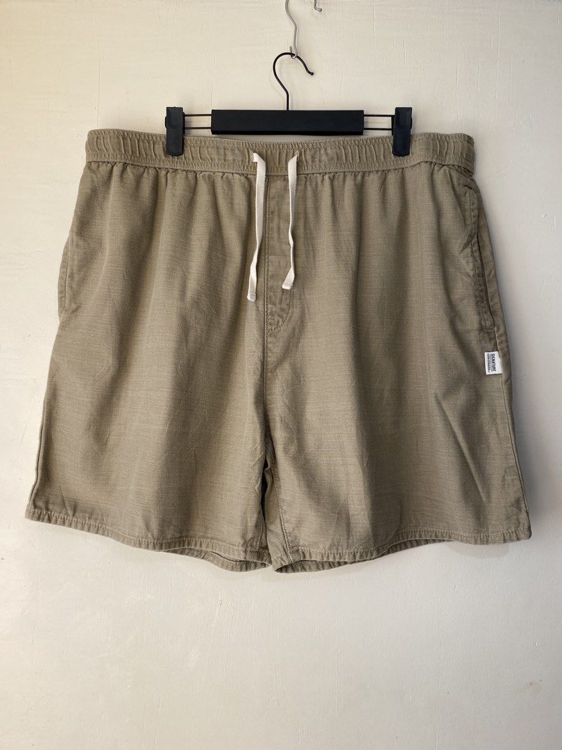 LEVI’S,Casual shorts (Category: Shorts) located in Cavite. Submitted by jc_thrift95 (Listing ID 1466466674, Image 1). Description: - The image shows a pair of tan or khaki-colored relaxed-fit men’s casual shorts with an elastic drawstring waistband and a small woven label tag on the lower-left leg. - Made in Pakistan - L- 19.5 inch - W- 19 inch up stretch. - Color rate 9/10 - See pictures details for dimes..