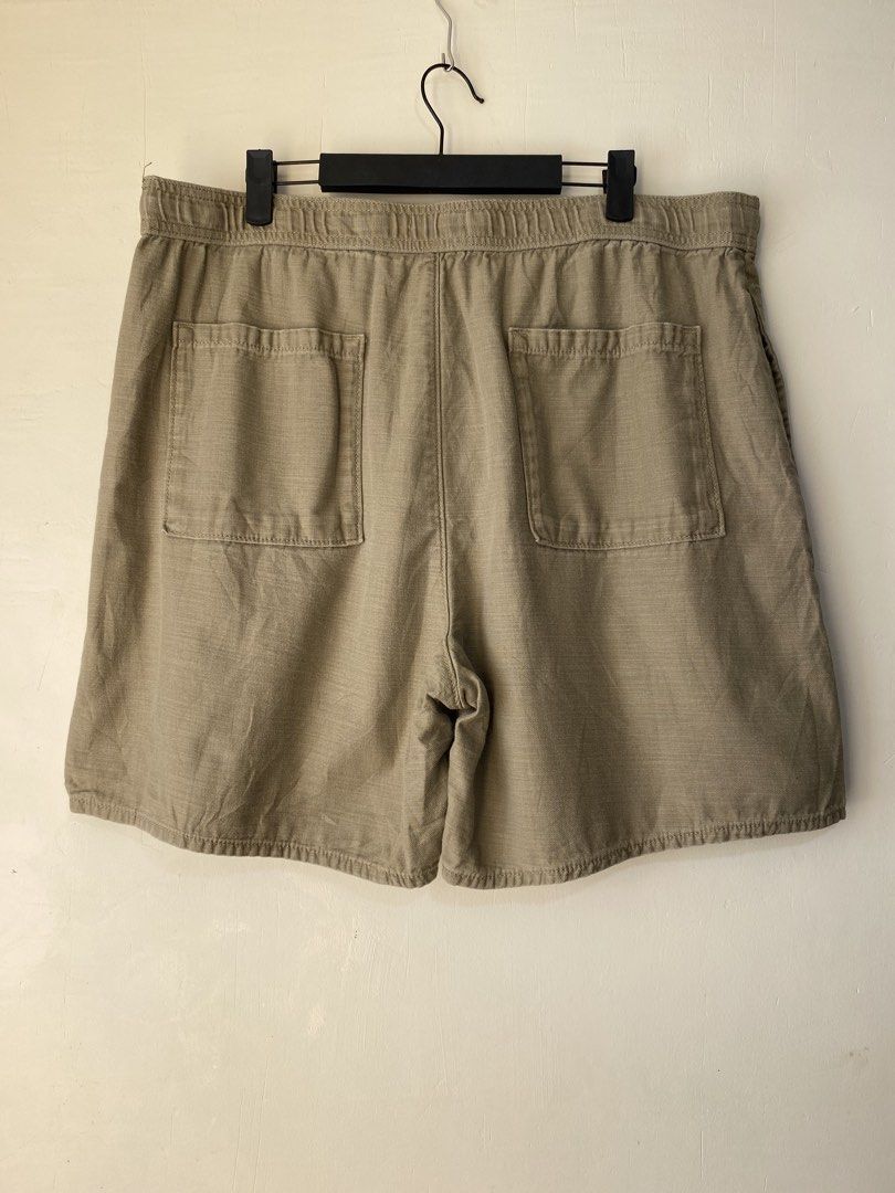 LEVI’S,Casual shorts (Category: Shorts) located in Cavite. Submitted by jc_thrift95 (Listing ID 1466466674, Image 2). Description: - The image shows a pair of tan or khaki-colored relaxed-fit men’s casual shorts with an elastic drawstring waistband and a small woven label tag on the lower-left leg. - Made in Pakistan - L- 19.5 inch - W- 19 inch up stretch. - Color rate 9/10 - See pictures details for dimes..