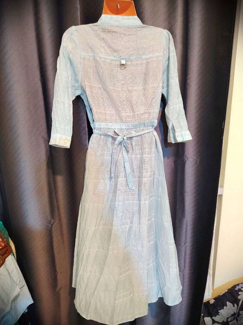 Light blue button-down midi dress with tie waist (Category: Dresses) located in Quezon City. Submitted by timelesstreasure117 (Listing ID 1466501621, Image 2). Description: can fit small to medium no inner lining. non stretch, linen feel type of fabric ₱50 no issues.