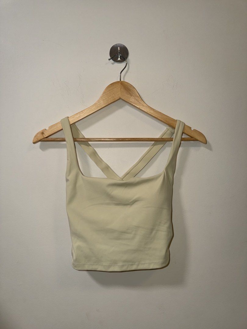 Light Yellow Activewear Crop Top with Strappy Back (Category: Activewear) located in Makati City. Submitted by andzr. (Listing ID 1466481071, Image 1). Description: - Color: Light yellow - Style: Activewear crop top - Neckline: Square front neckline with stylish crisscross straps on the open back - Support: Features a visible built-in bra band for extra support - Length: Cropped fit that sits right above the waist - Fabric: Soft, high-stretch mat