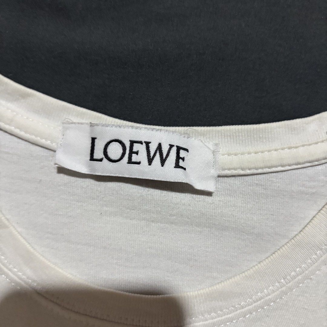 LOEWE EMBROID LOGO WHITE SHIRT (Category: Shirts) located in Taytay. Submitted by dwinsapparel (Listing ID 1466450477, Image 3). Description: LOEWE CHEST EMBROID LOGO WHITE SHIRT W-21 L-25 EXCELLENT CONDITION NEED WASH MISSING WASH TAGS.