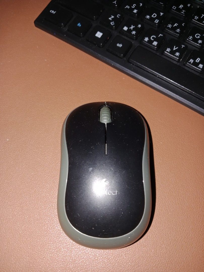 Logitech M185 Wireless Mouse Black Grey (Category: Mouse & Mousepads) located in Manila. Submitted by jamielleej87951 (Listing ID 1466452728, Image 1). Description: - Authentic Logitech M185 wireless mouse - Stylish black top cover with comfortable grey side grips - Standard 2-button layout with a smooth central scroll wheel - Equipped with an on/off switch near the optical sensor to save battery - Battery-operated for easy, portable plug-and-pla