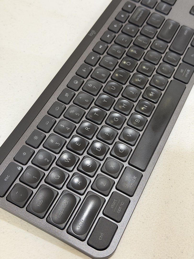 Logitech MX Keys S Wireless Keyboard (Category: Computer Keyboard) located in Quezon City. Submitted by zyllus30 (Listing ID 1466365582, Image 2). Description: - Color: Graphite grey with full-size layout and numpad - Switches: Scissor switch keys with finger indents for comfortable typing - Connectivity: Dual connection via Bluetooth or Logi Bolt receiver - Smart Features: Built-in smart illumination with proximity sensors - Power: USB-C recharg