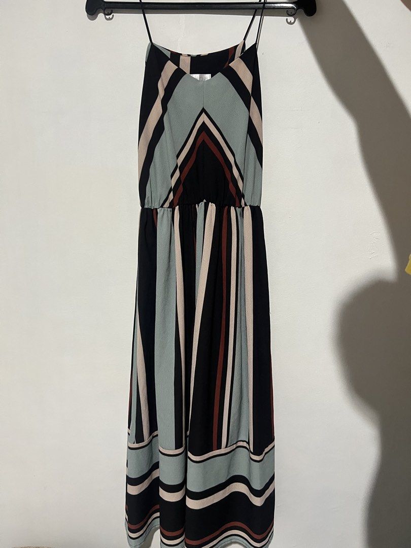 Long spaghetti strap maxi dress with multicolored stripes (Category: Dresses) located in Manila. Submitted by shecuratedit (Listing ID 1466408078, Image 1). Description: Chic and lightweight maxi dress featuring bold vertical stripes in black, sage green, beige, and rust red. Designed with delicate spaghetti straps, a comfortable elastic waist, and a stylish striped border hem. Perfect for casual days out or warm-weather getaways!.