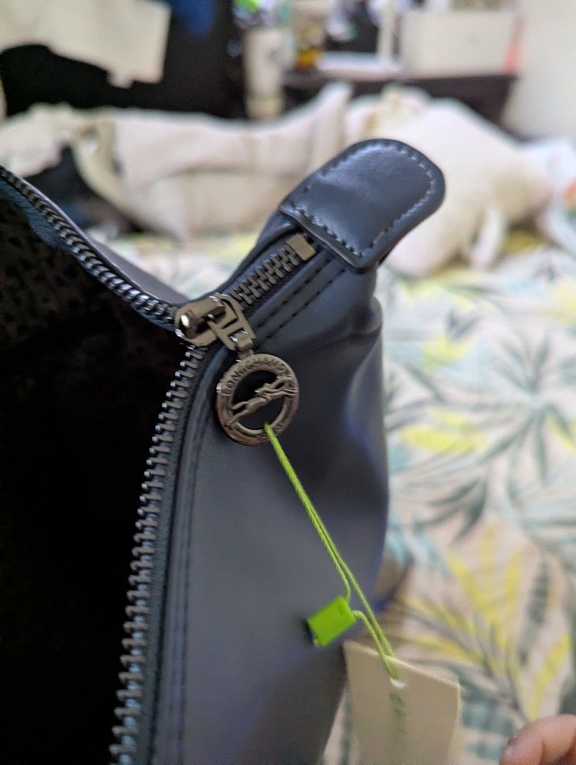 Longchamp Le Pliage Green Backpack Navy Blue (Category: Backpacks) located in Taguig. Submitted by roxie0419 (Listing ID 1466419447, Image 1). Description: - Brand: Longchamp Le Pliage Green Backpack - Color: Dark Navy Blue - Condition: Brand new, never used (tag still attached by green loop) - Features: Adjustable branded straps, top handle, and secure zip closure with iconic horse medallion pull - Interior: Spacious main compartment with a zipp