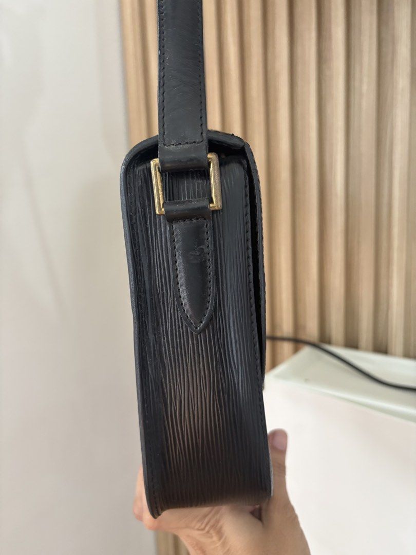 Louis Vuitton Black Epi Leather Shoulder Bag (Category: Luxury Bags & Wallets) located in Alicia. Submitted by berly06 (Listing ID 1466390361, Image 3). Description: - Brand: Louis Vuitton - Material: Textured Epi leather in deep black - Hardware: Brass with adjustable strap - Closure: Structured flap with branded metal ring drop - Details: Subtle LV initials embossed on the bottom corner - Style: Classic vintage daily carry crossbody bag.