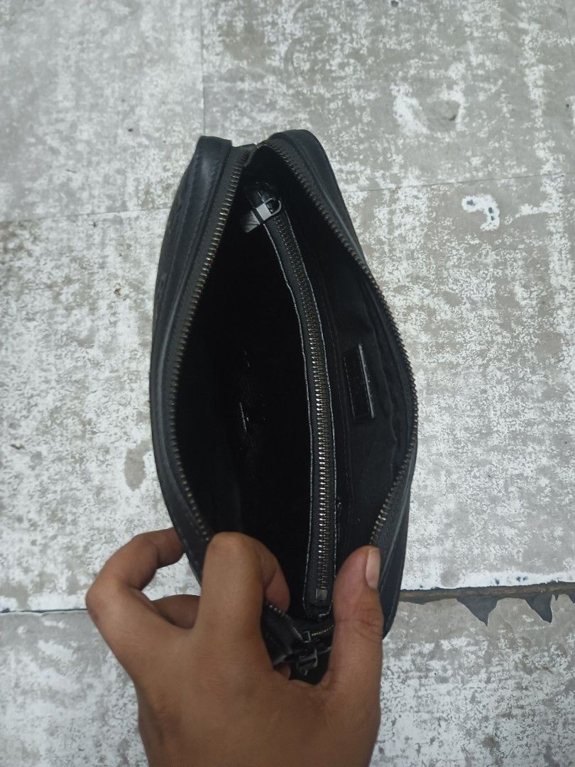 Louis Vuitton Black Shadow Monogram Trio Messenger Bag (Category: Luxury Bags & Wallets) located in Baguio. Submitted by brandeditems16 (Listing ID 1466542974, Image 3). Description: Black Louis Vuitton Trio Messenger bag in embossed monogram leather. Includes the main crossbody bag, a small detachable zip pouch on the strap, and a separate flat pouch. Adjustable fabric shoulder strap with woven branding. Dark hardware throughout. Clean interior 