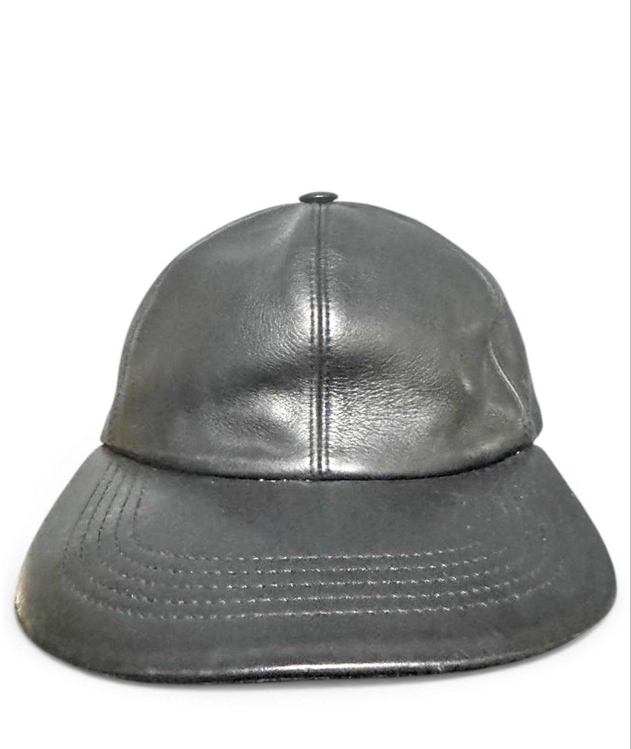 Louis Vuitton Leather Cap (Category: Caps & Hats) located in Marikina City. Submitted by anndergroundmarket (Listing ID 1466368073, Image 1). Description: - Brand: Louis Vuitton - Material: Premium black leather - Design: Classic six-panel construction with curved brim - Details: Debossed LV logo patch on the side panel - Interior: Signature Monogram lining inside the crown - Fit: Adjustable strap at the back with branded metal buckle - Condition