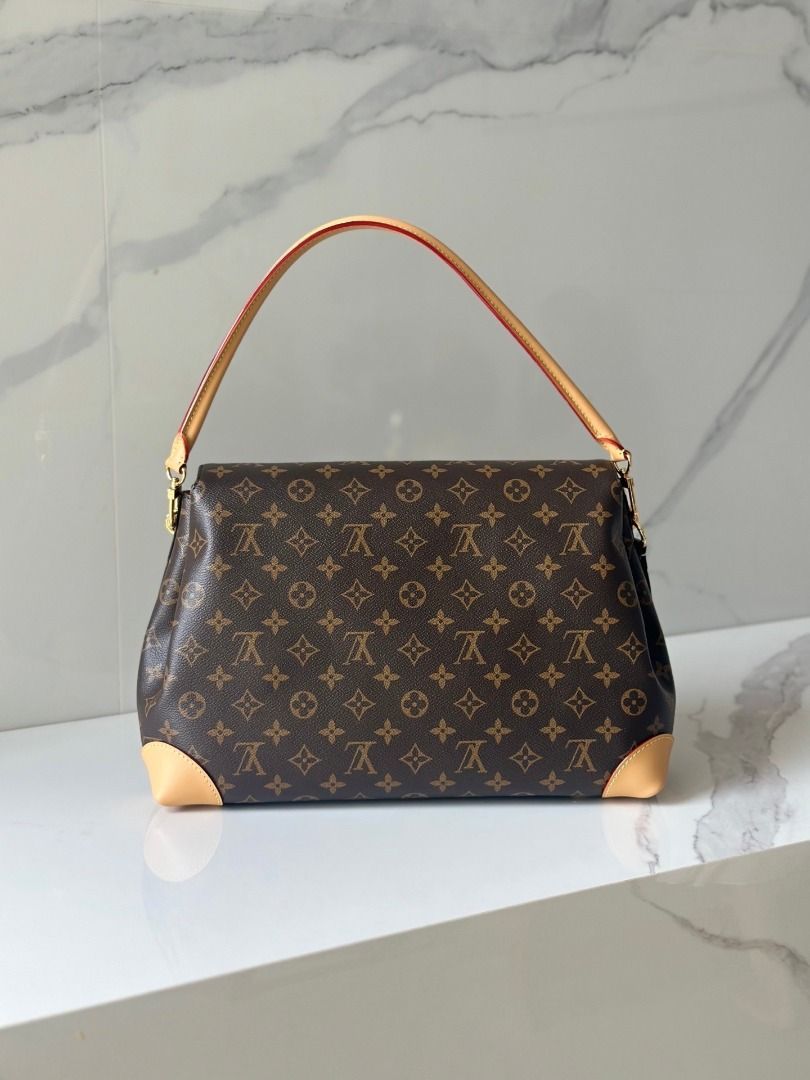 Louis Vuitton Monogram Canvas Shoulder Bag (Category: Luxury Bags & Wallets) located in Quezon City. Submitted by vangjalaya37815 (Listing ID 1466441496, Image 2). Description: - Authentic Louis Vuitton Monogram canvas shoulder bag with signature brown and tan pattern - Premium cowhide leather trim and durable structured handle - Secure functional front padlock closure featuring iconic LV engraving - Protected bottom corners with reinforced leath