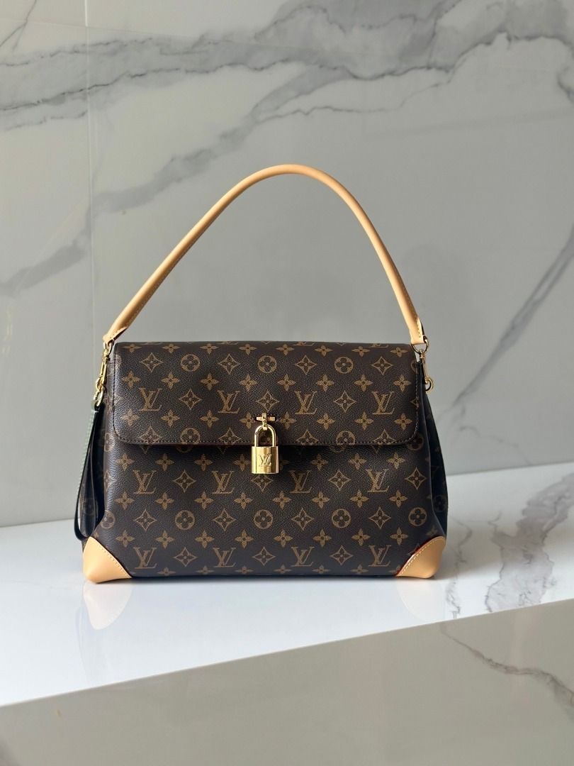 Louis Vuitton Monogram Canvas Shoulder Bag (Category: Luxury Bags & Wallets) located in Quezon City. Submitted by vangjalaya37815 (Listing ID 1466441496, Image 1). Description: - Authentic Louis Vuitton Monogram canvas shoulder bag with signature brown and tan pattern - Premium cowhide leather trim and durable structured handle - Secure functional front padlock closure featuring iconic LV engraving - Protected bottom corners with reinforced leath