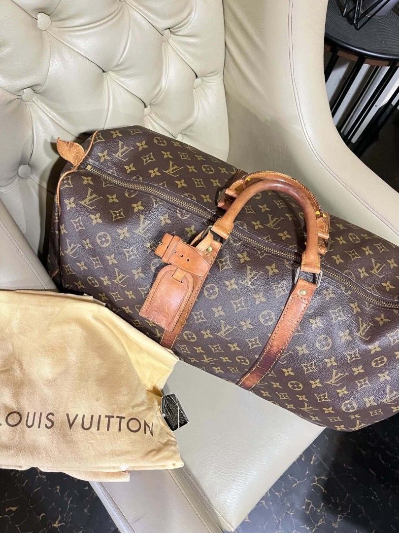 Louis Vuitton Monogram Keepall Duffle Bag (Category: Luxury Bags & Wallets) located in Manila. Submitted by keencrystal.595c28 (Listing ID 1466523179, Image 2). Description: - Authentic Louis Vuitton Monogram travel bag - Classic brown canvas with tan leather handles and trim - Durable brass hardware with secure top zip closure - Clean brown textile interior lining - Includes original luggage tag and dust bag.
