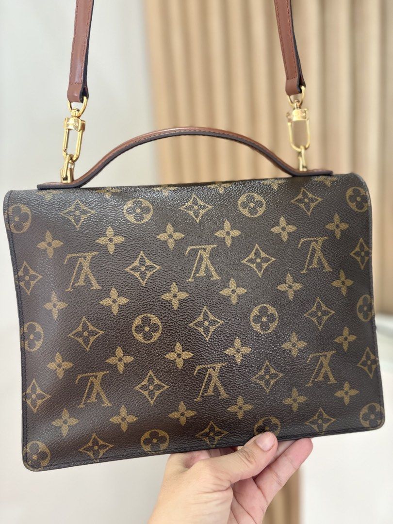 Louis Vuitton Monogram Pochette Metis Handbag (Category: Luxury Bags & Wallets) located in Alicia. Submitted by berly06 (Listing ID 1466390060, Image 2). Description: - Authentic Louis Vuitton monogram canvas handbag - Brown leather top handle and matching detachable shoulder strap - Gold-tone hardware with engraved LV lock clasp closure - Structured rectangular silhouette with clean contrast stitching - Multiple interior compartments for easy or