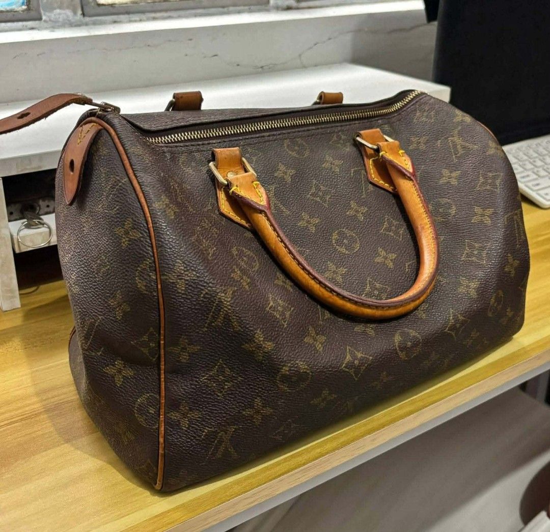 Louis Vuitton Monogram Speedy Handbag (Category: Luxury Bags & Wallets) located in Tarlac. Submitted by den420 (Listing ID 1466472694, Image 1). Description: - Classic brown monogram canvas design - Dual Vachetta leather handles with yellow contrast stitching - Secure zip-top closure with engraved gold-tone hardware - Brown textile interior featuring a convenient side pocket and stamped leather tag - Timeless everyday tote bag for any occasion.